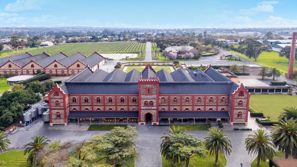 Aerial view of Château Tanunda winery with vineyards and historic building.